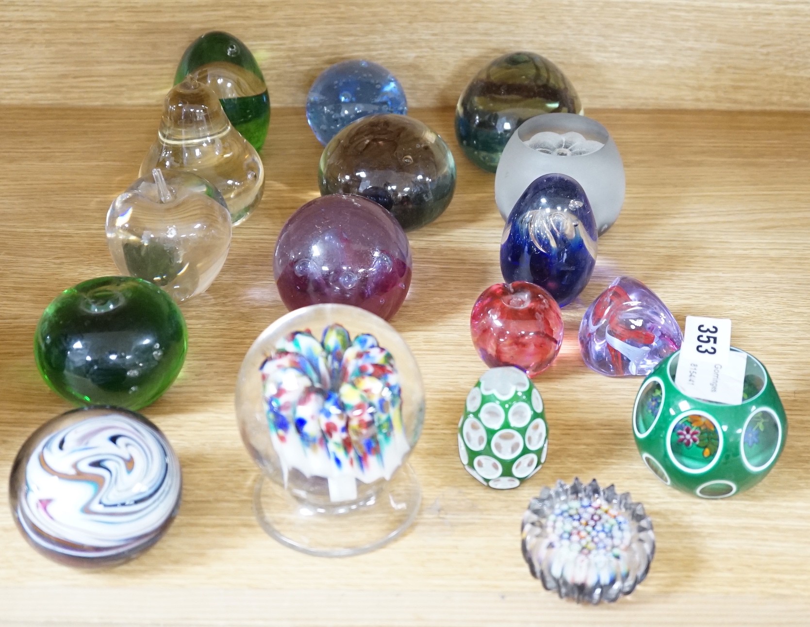 A collection of mixed paperweights to include a faceted floral Perthshire example, other Scottish floral and millefiori examples (Qty), tallest 12cms high